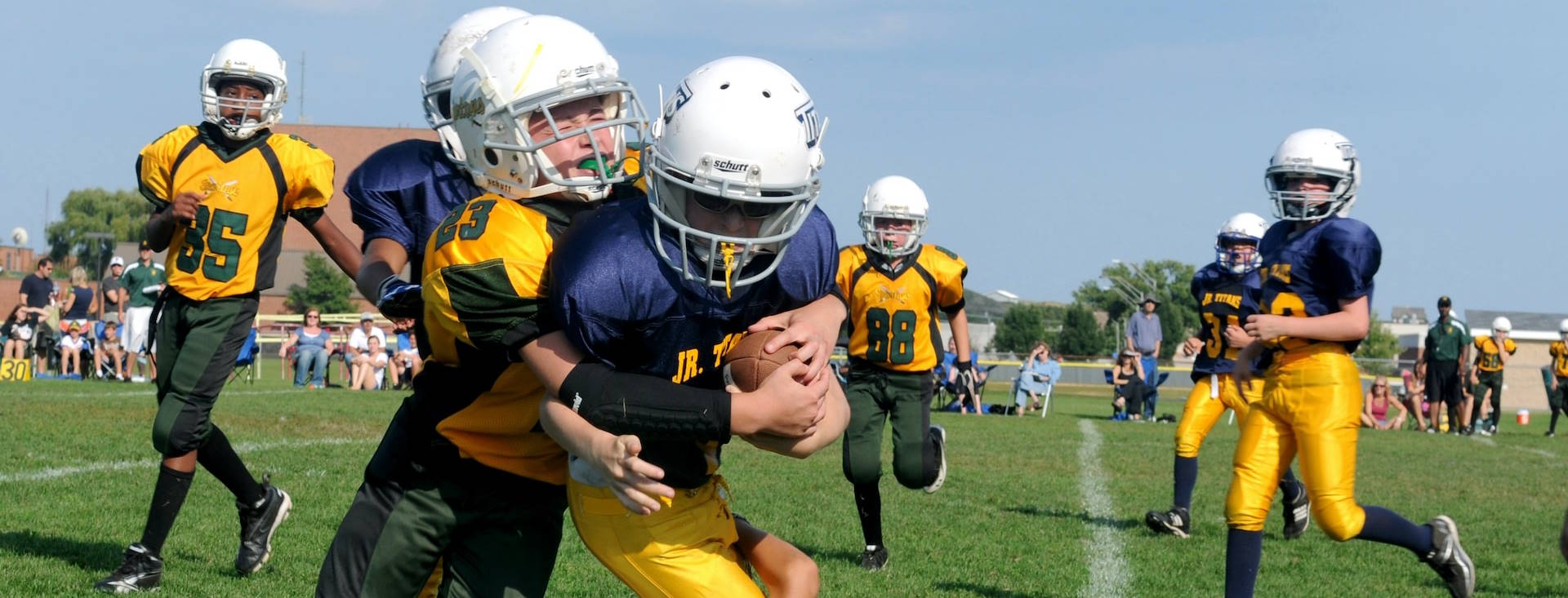 Children playing tackle football and being exposed to concussions.